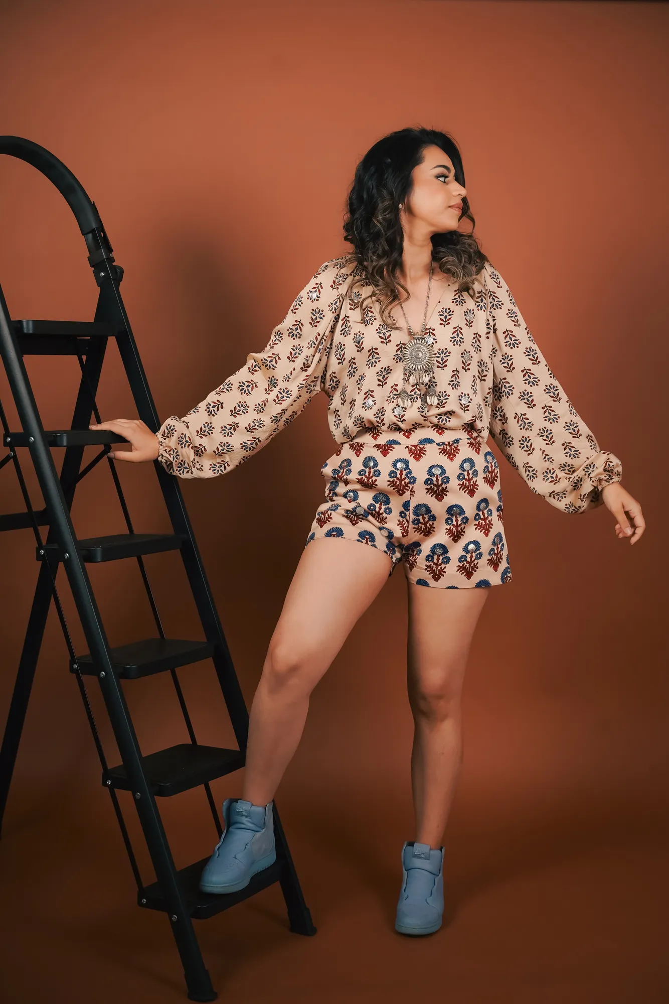 Pavni posing on the ladder set at SparQ Spaces